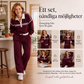 Damset med randig sweatshirt och vida byxor