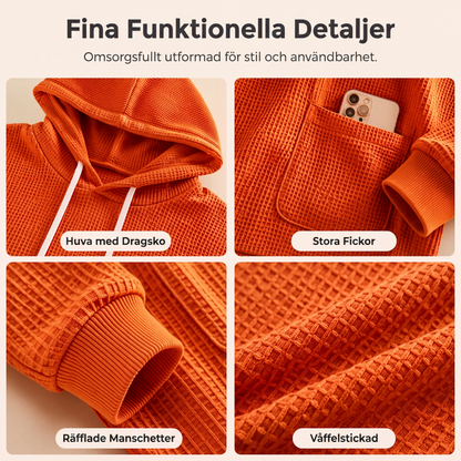 Damernas vaffelstickade luvtröja med lös passform och fickor