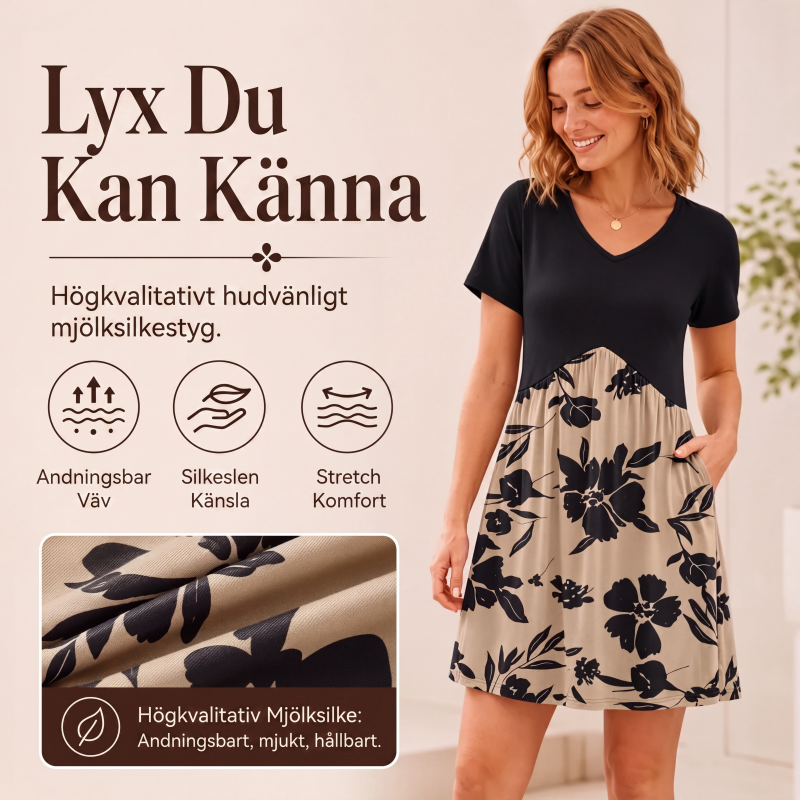 Damklänning med V-ringning och korta ärmar, längd upp till mitten av vaden